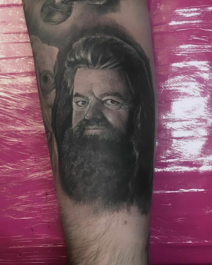 Harry Potter tattoo featuring a portrait of Hagrid on an arm.