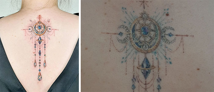 Aged tattoos on the back, showing faded colors and blurred lines over time.