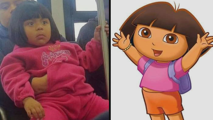 Dora The Explorer and similar looking girl on parents knees 