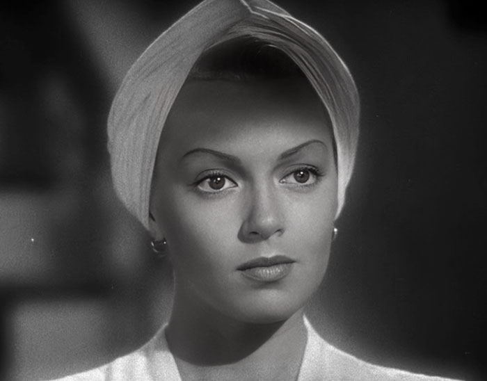 Lana Turner in a classic black and white portrait wearing a white headband, featured among famous people married multiple times