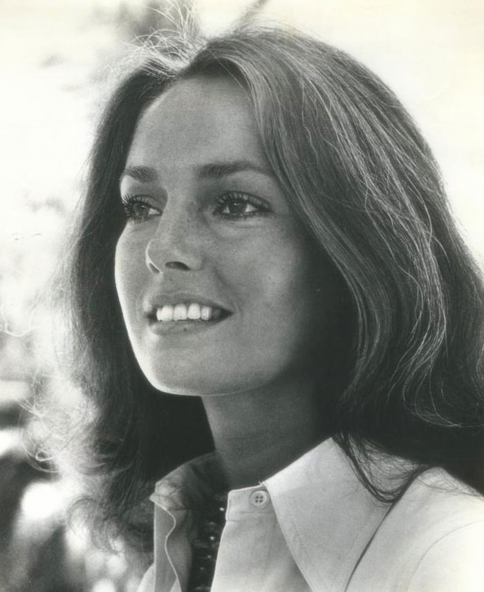Jennifer O'Neill in a white shirt, smiling and looking away, featured among famous people who got married multiple times.