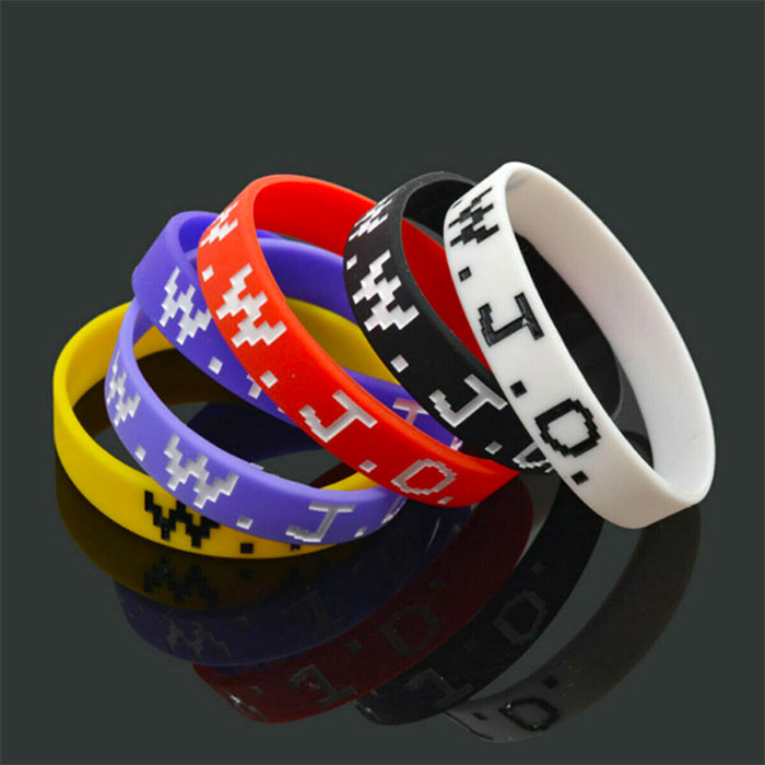 Colorful silicone wristbands stacked together, illustrating popular big trends from past decades and nostalgia.