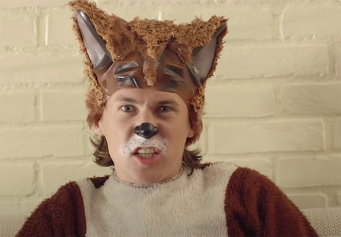 Man dressed in a furry animal costume with face paint, representing one of the big trends we almost forgot existed.