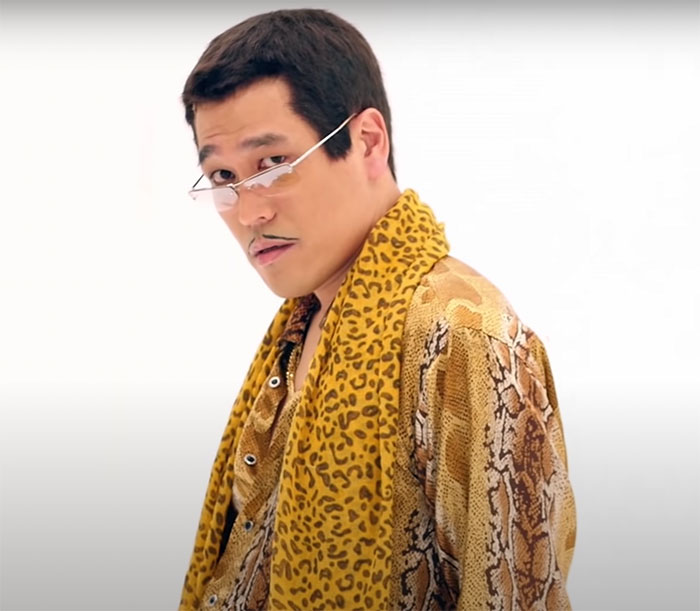 Man wearing retro animal print clothing and small sunglasses, representing big trends that we almost forgot existed.