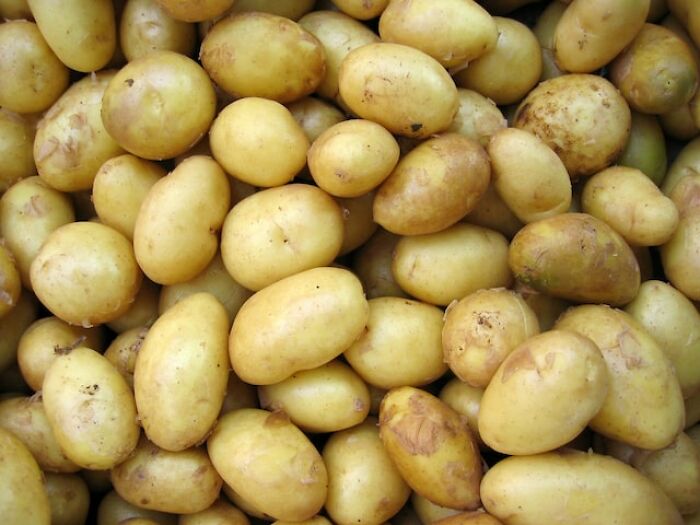 A pile of fresh potatoes, a traditional product many people find harder to afford today.