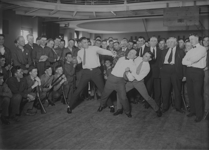 Black and white picture of Jack Dempsey, Harry Houdini and Benny Leonard posing