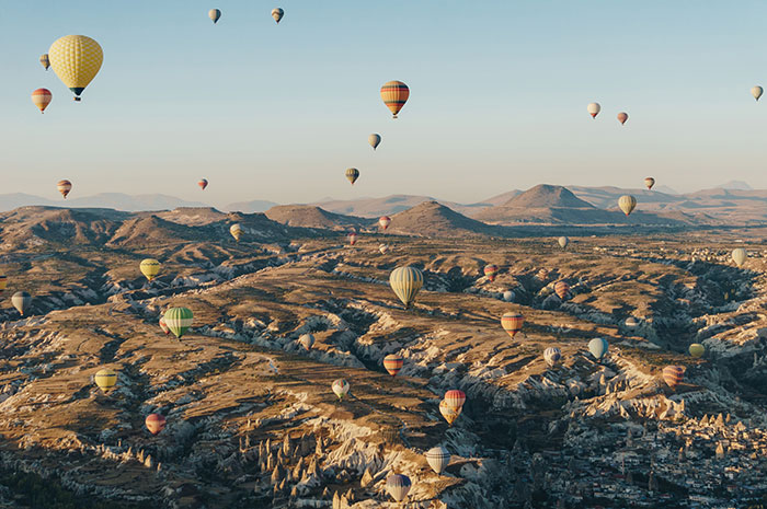 Mountain landscape with hot air balloons
