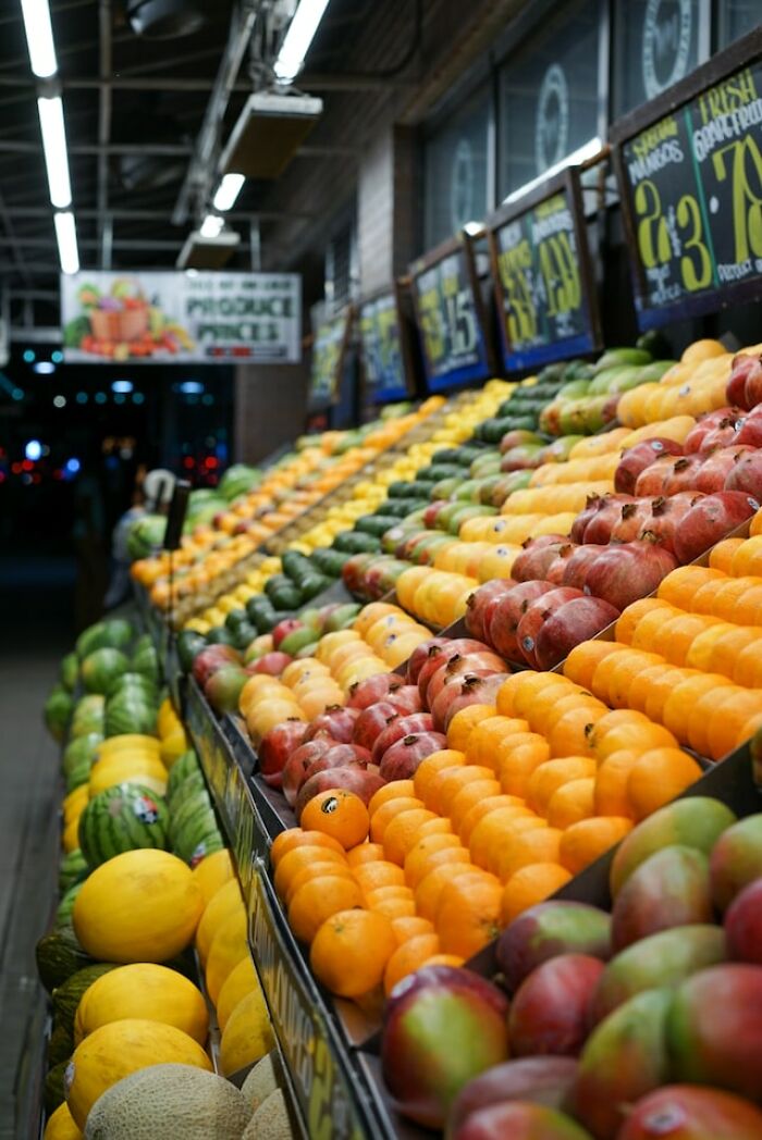 Colorful fresh produce arranged in rows at a market highlighting products people can no longer afford.