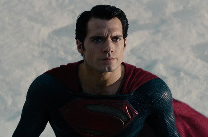 "Big Hero Jumps Landing Into Three-Point Stance With Head Down. Then Head Slowly Lifts Up With Determined Look"