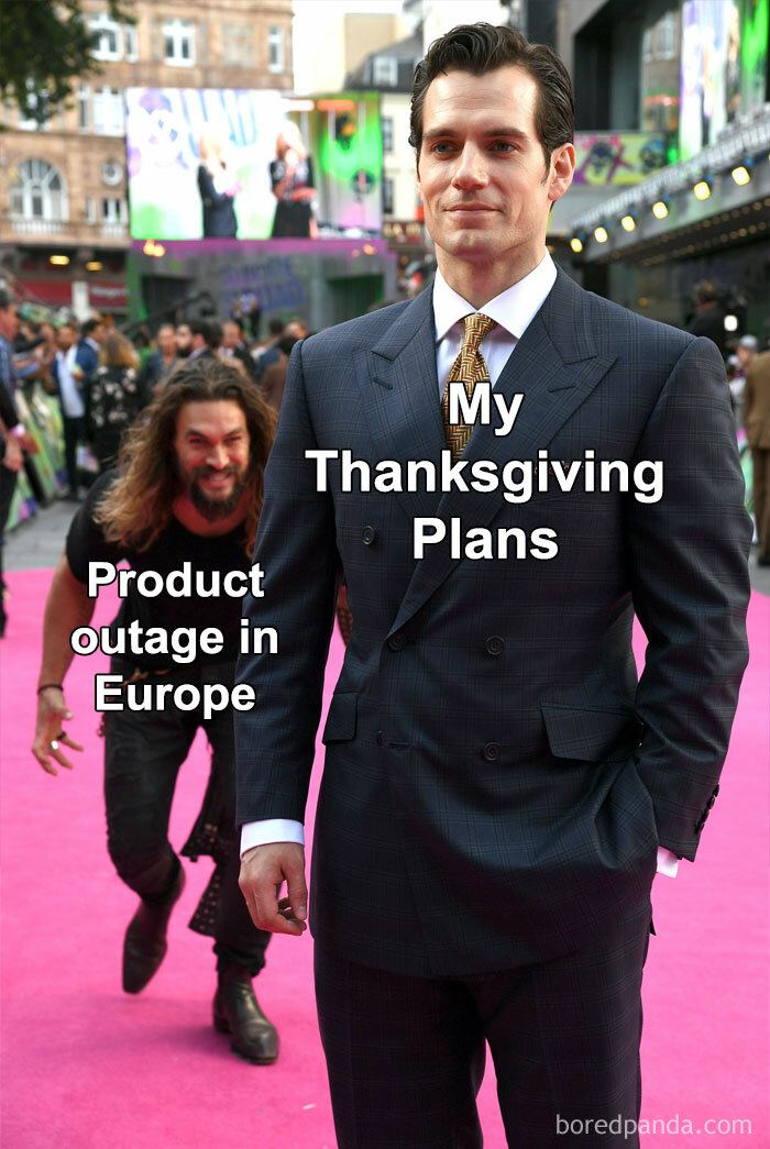 Man in suit representing product manager problems calmly facing product outage in Europe disrupting plans on a busy event red carpet.