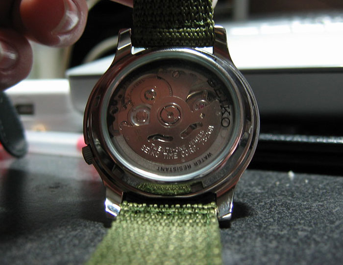 Close-up of a watch repair in progress, highlighting a profession that may soon disappear due to automation trends.