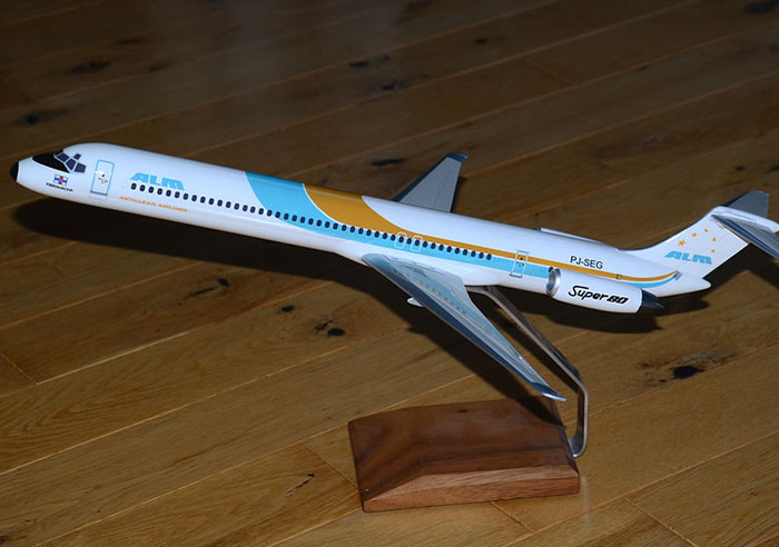 Model airplane on wooden stand representing professions that may soon disappear in evolving industries