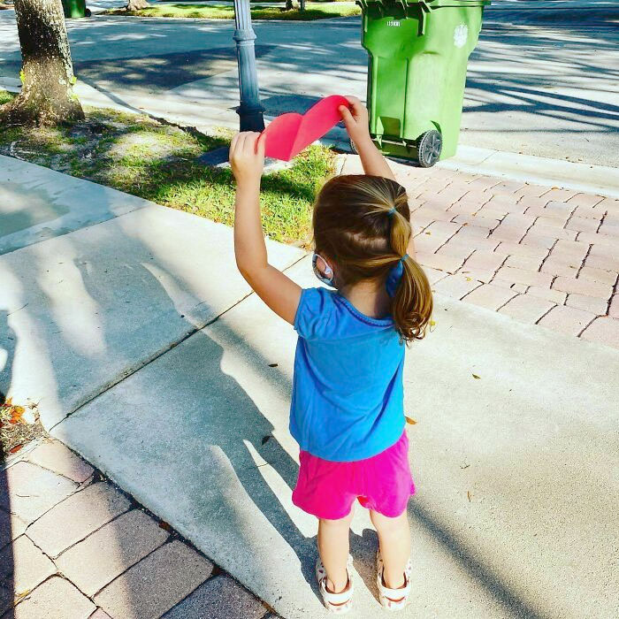 Waiting To Give Her Favorite Trash Truck Driver His Valentine