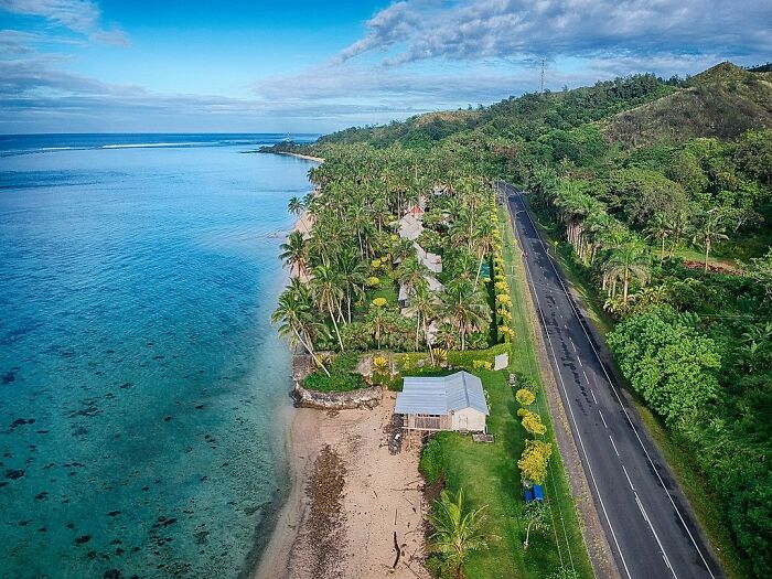Forest with road near ocean in Fiji