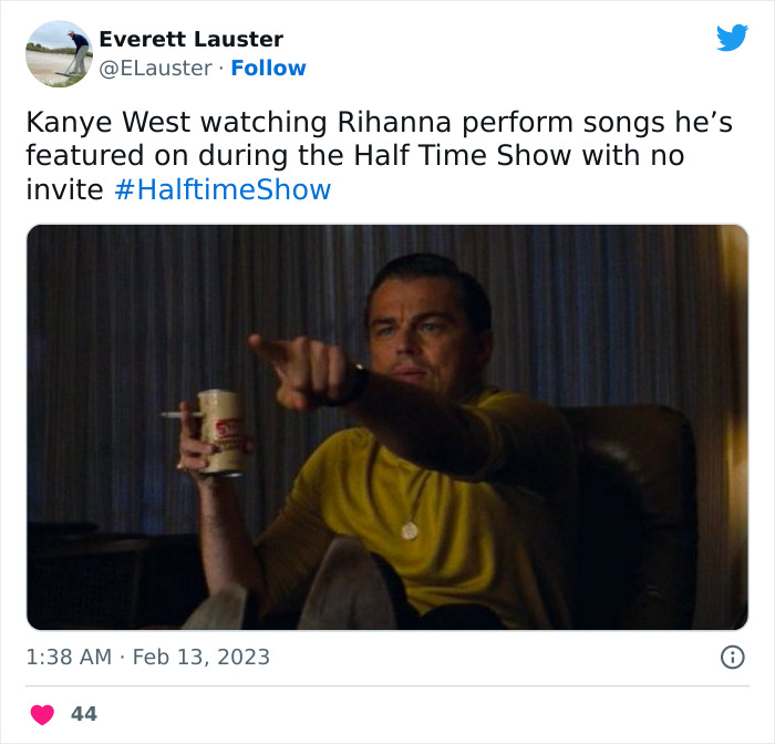 Man in yellow shirt pointing at TV with drink, labeled as meme. Super Bowl 2023 Rihanna performance reactions.