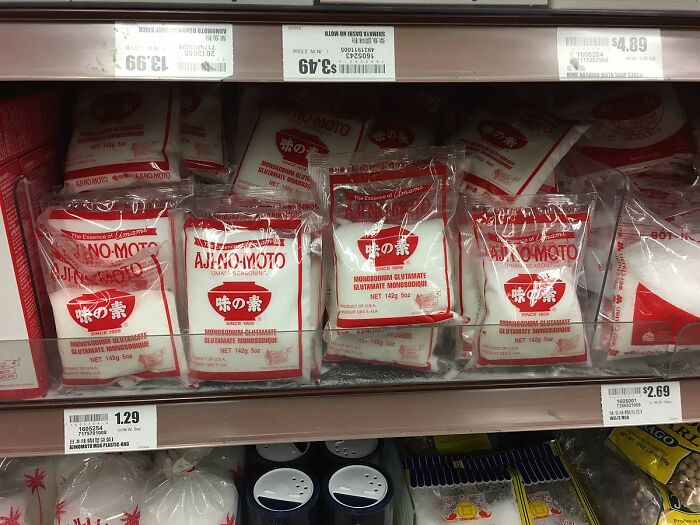 Packets of monosodium glutamate (MSG) on a store shelf, commonly associated with food myths.
