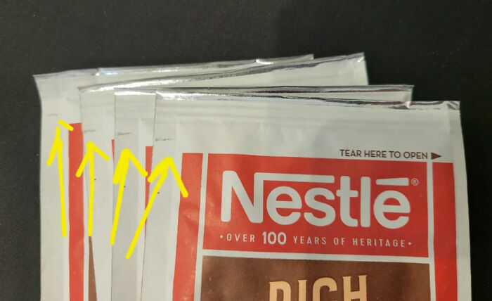Nestlé packaging with arrows indicating opening direction, clarifying common myths about opening sachets.