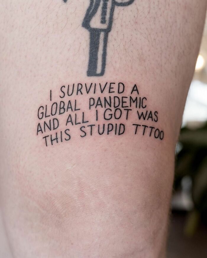 Funny knee tattoo with quote about surviving a global pandemic.