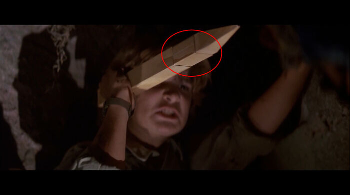 In The Lost Boys (1987), Just Before Edgar Stabs Marko, You Can Clearly See Where The Fake Stake Was Meant To Retract To Avoid Injuring Alex Winter