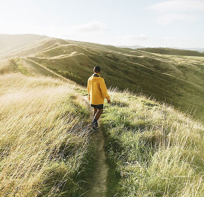 Solo Person Hiking In The Mountains 
