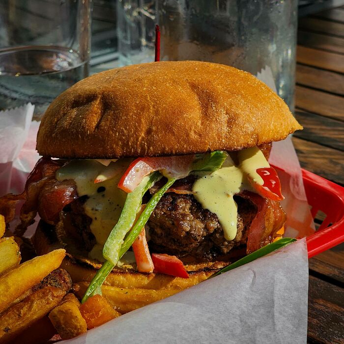 Burger With Pepper Slaw, Brie, Tomato, Bacon, And Verde Sauce At Table 9 - Morgantown, WV