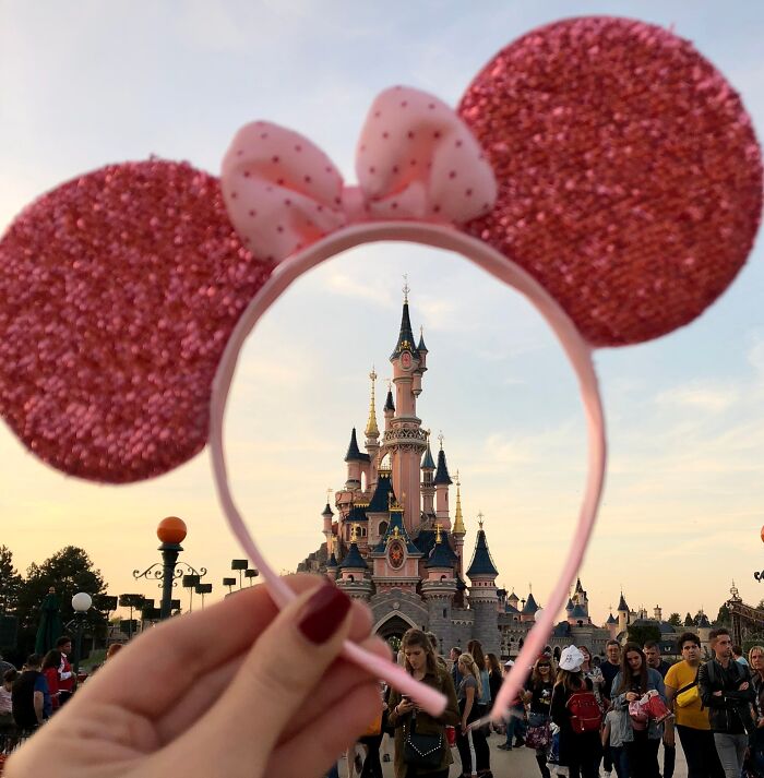 Mickey Mouses ears and a Disneyland castle in front