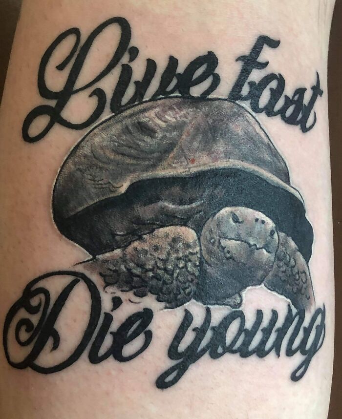 Funny turtle tattoo with text "Live Fast, Die Young" in bold script.
