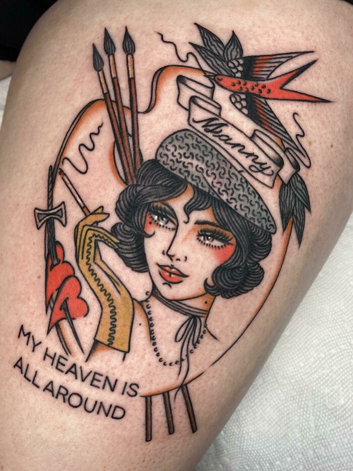 Tattoo of a woman with classic style and birds, featuring the phrase "My heaven is all around," showcasing creative word tattoos.