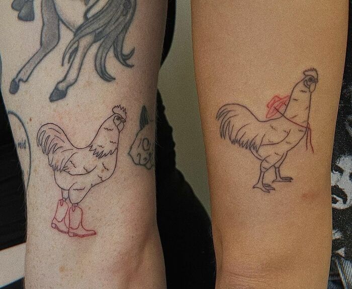 Chicken-themed best friend tattoos on arms, one with boots and the other with a bandana.