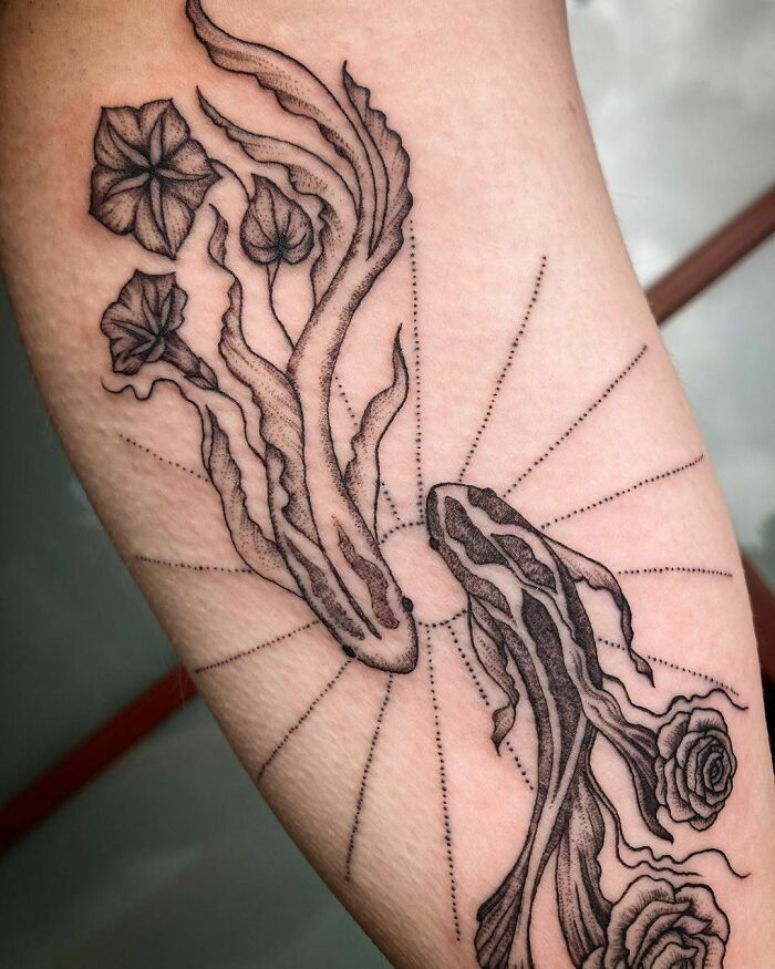 Nature tattoo featuring detailed flowers and abstract patterns celebrating Mother Earth.