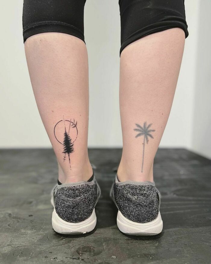 Nature tattoos of trees on the back of legs, symbolizing connection to Mother Earth.