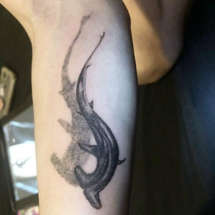 Nature tattoo of a whale shark on a person's arm, symbolizing a connection with the ocean.