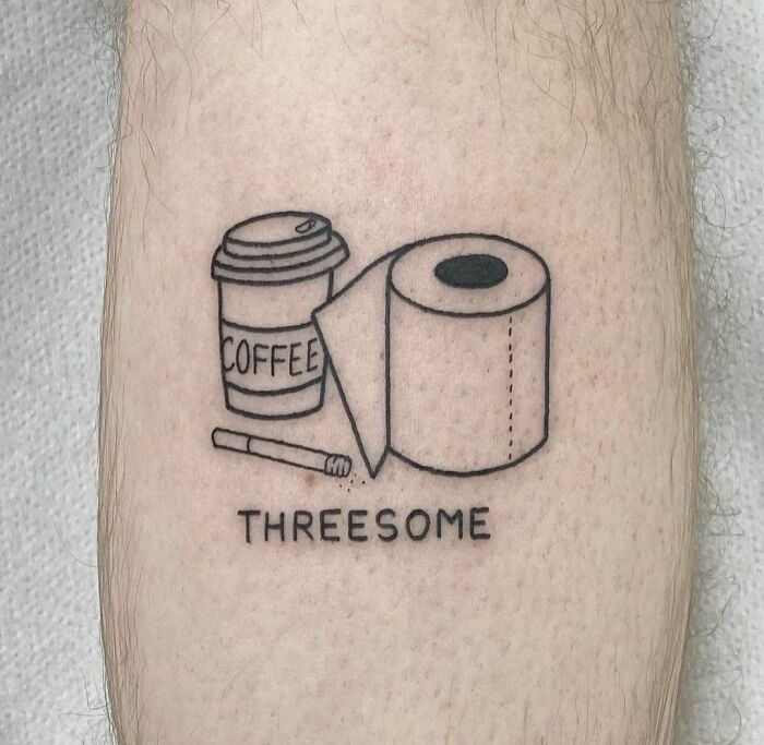 Funny tattoo of a coffee cup, toilet paper, and cigarette labeled "T*******e" on skin.