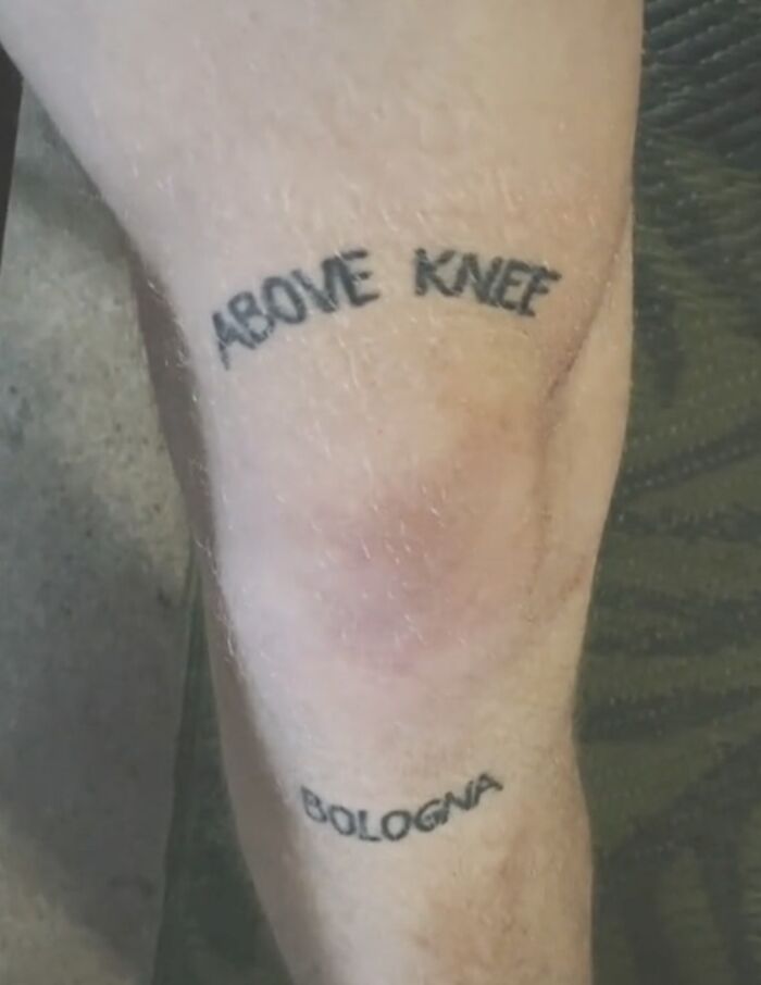 Funny tattoo reading "Above Knee Bologna" inked on a person's leg, adding humor with wordplay.