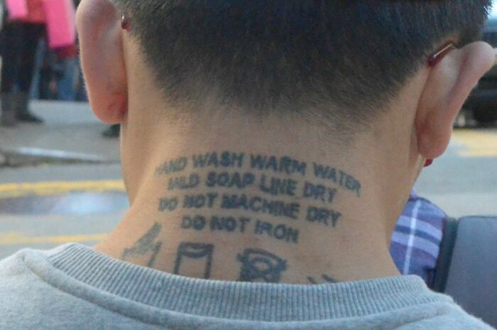 Tattoo on neck with funny laundry instructions, bringing humor and smiles.