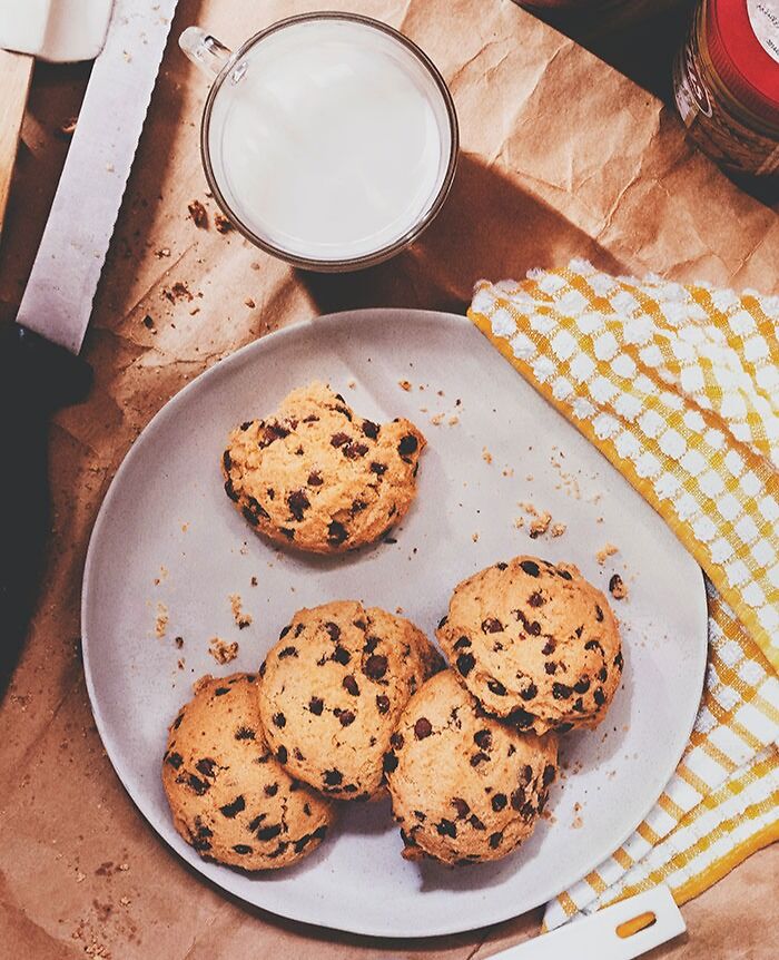 cookies on a plate and milk in a cup 