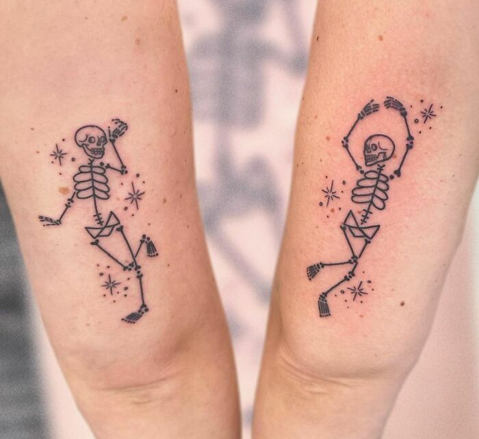 BFF tattoos featuring dancing skeletons on forearms.