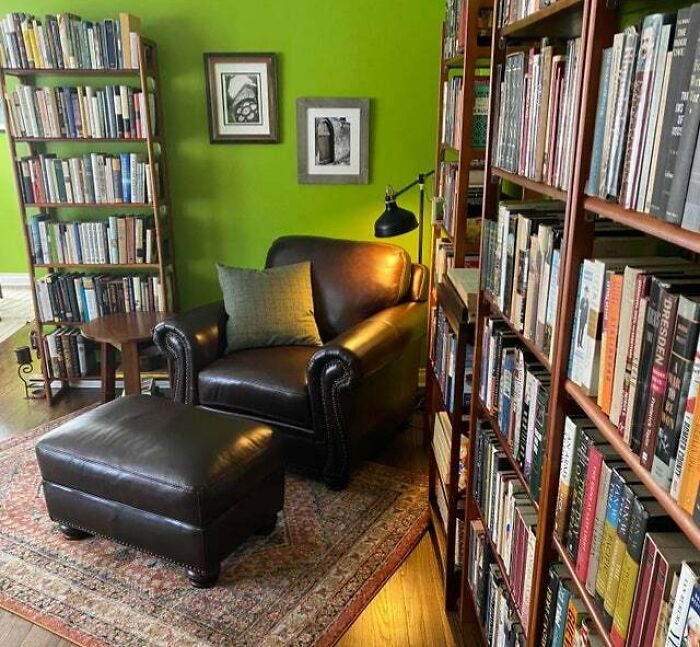 Brown leather chair with pillow 