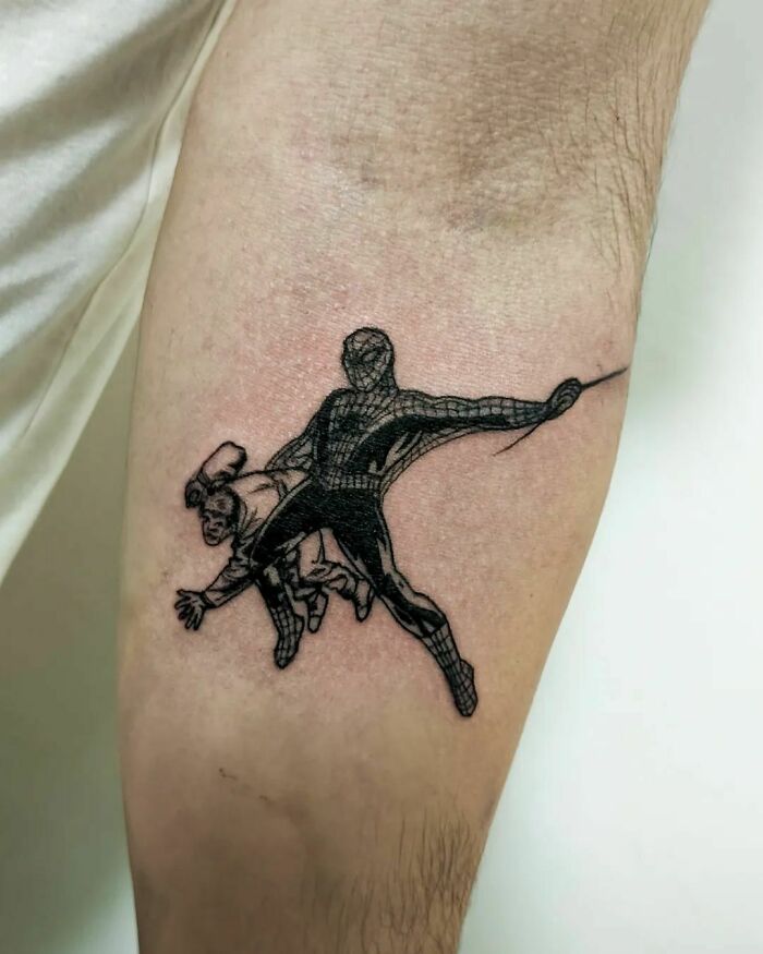 Marvel tattoo featuring Spider-Man in action on an arm.
