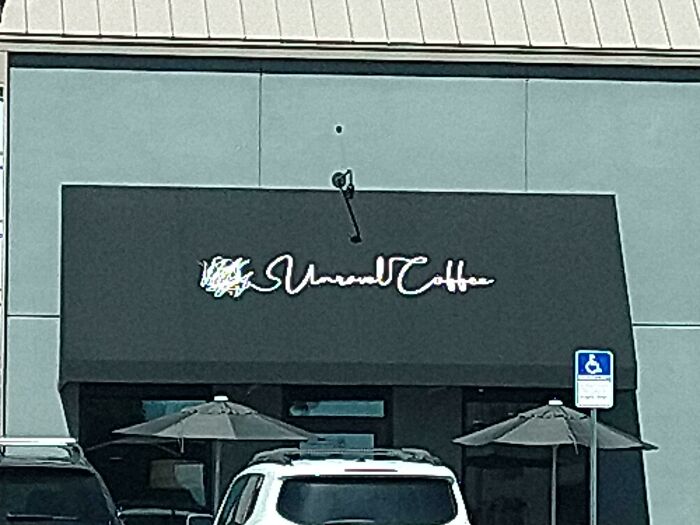 The Sign On This Coffee Shop Is Terrible. I Can't Even Read The First Word. I Can't Imagine They Thought This Through