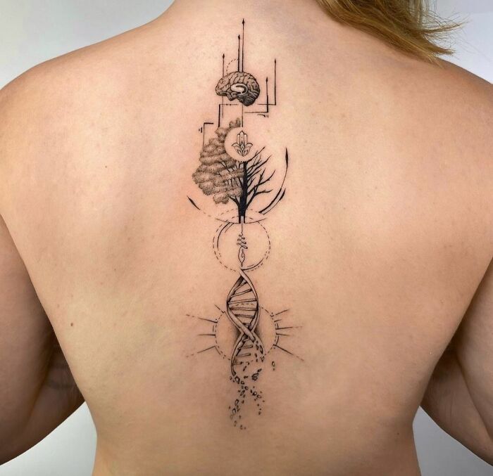 Back tattoo featuring geometric designs with nature and DNA elements, highlighting creativity through shapes and forms.