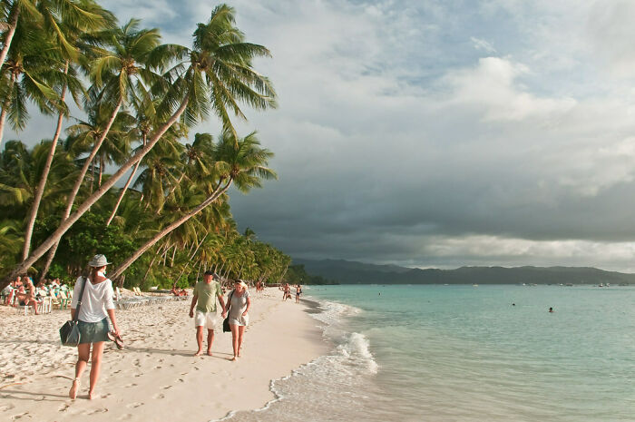 People walking at the beach in Boracay Island
