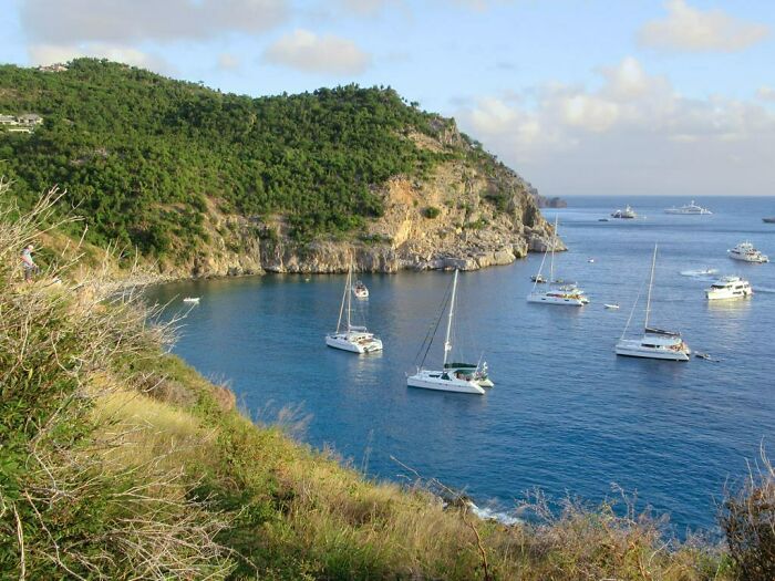 Ocean with boats and mountains near in St. Barts