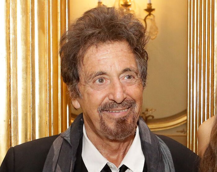 Al Pacino smiling at an event, representing celebrities who never married but found love in their lives.