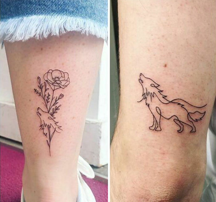 Wolf and flower-themed brother and sister tattoos on legs, symbolizing connection.