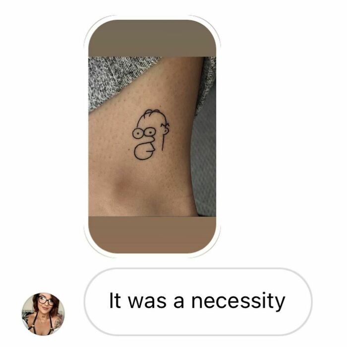 Minimal cartoon tattoo on leg with text “It was a necessity” below, showcasing a humorous tattoo choice.