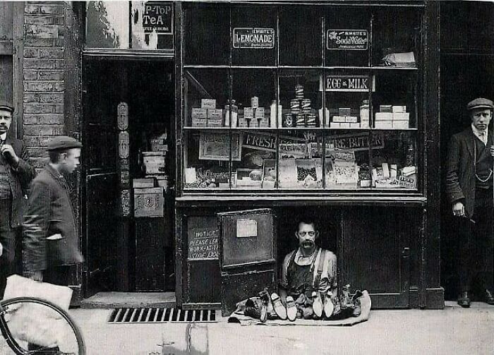 The Smallest Shop In London, Occupied By A Cobbler, At 4 Bateman Street, Soho. The Shop Is Six Feet Long, Five Feet High And Two Feet Deep, The Rent Three Pounds A Week, It Has Been Occupied For Over Twenty Years. C.1910