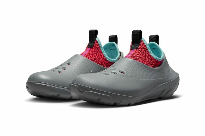 Unusual gray shoes with a red knitted collar and teal lining, featuring unique design elements.
