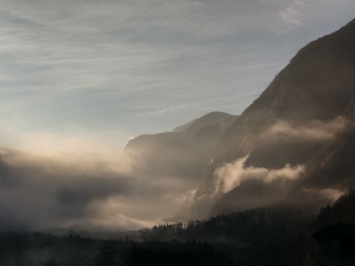 Southern Switzerland, Mountain Valley. Clouds Play On The Mountain Slopes
