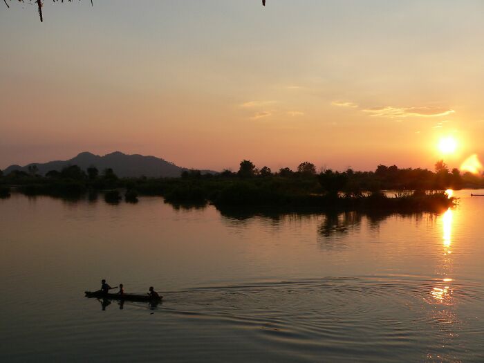 Kids Playing In A Sinking Boat On The Mekong
